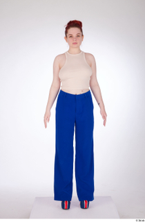 Yeva a-pose beige crop top blue pants casual dressed standing…